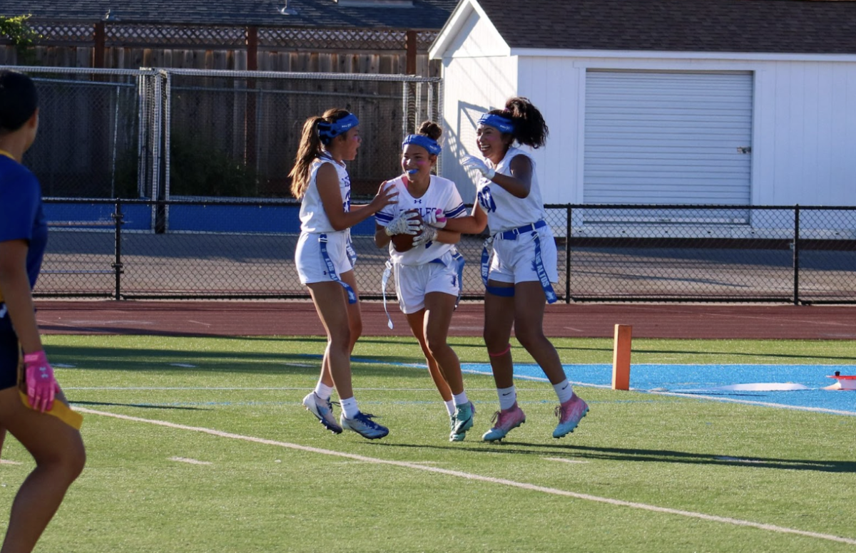 After Sophomore Oshea Orozco scores a touchdown, teammates senior Karla Araracap and senior Abigail Santos celebrate in the endzone,  putting them up by six points on Senior Night against Milpitas